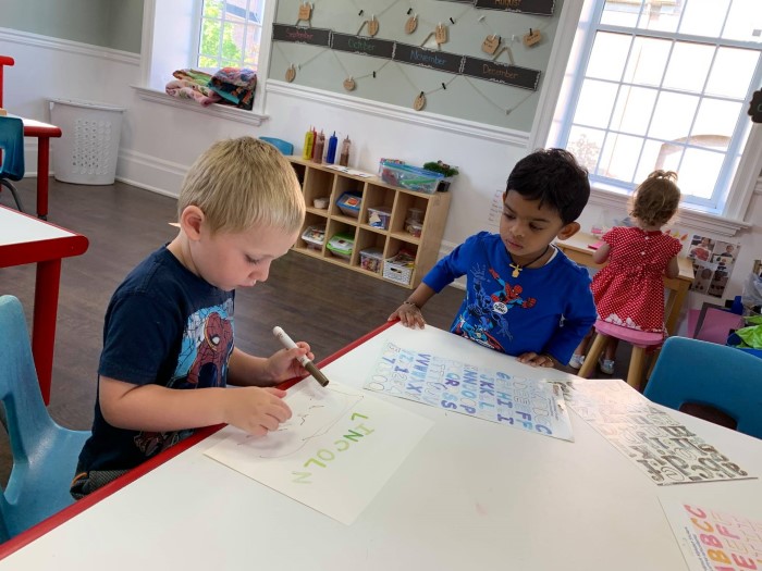 Two little boys are learning letters in EarlyON Years Centre