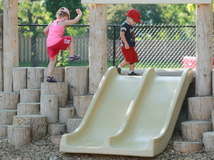 Kids are climbling wooden steps in EarlyON Years Centre