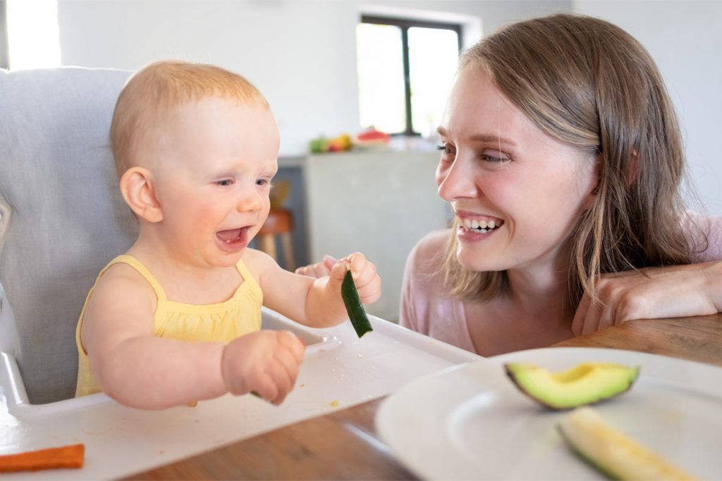 Baby eating solid food