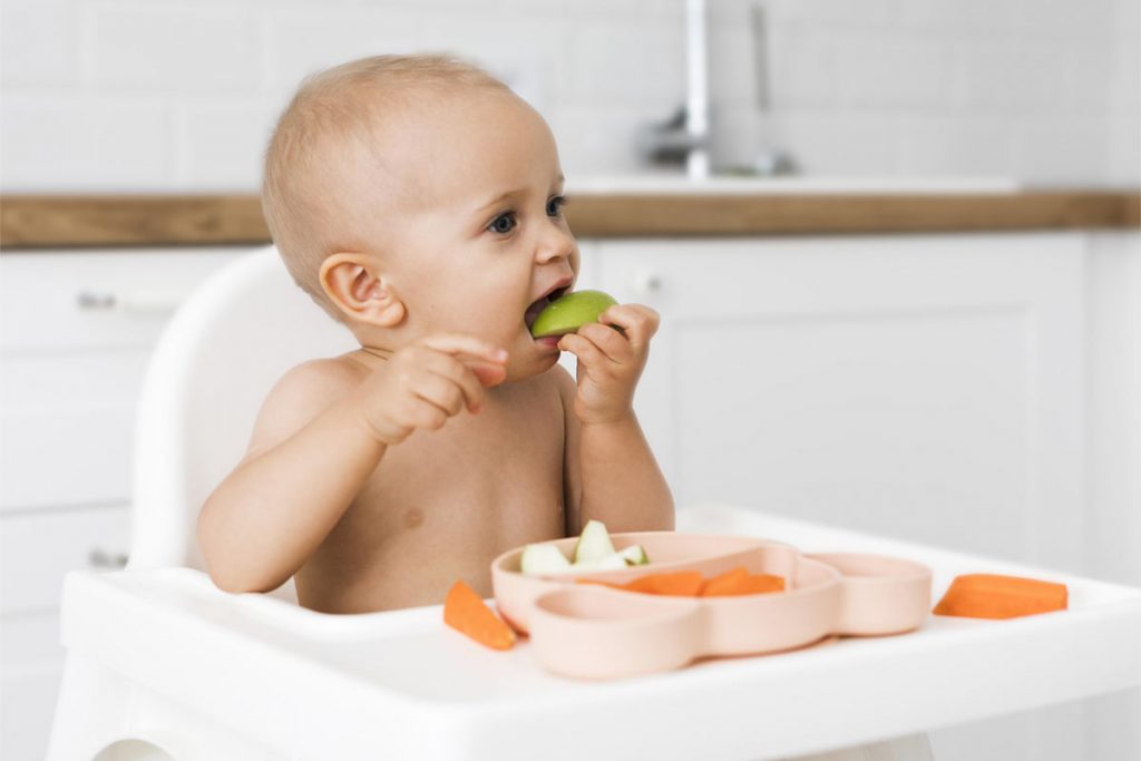 Baby girl with apple